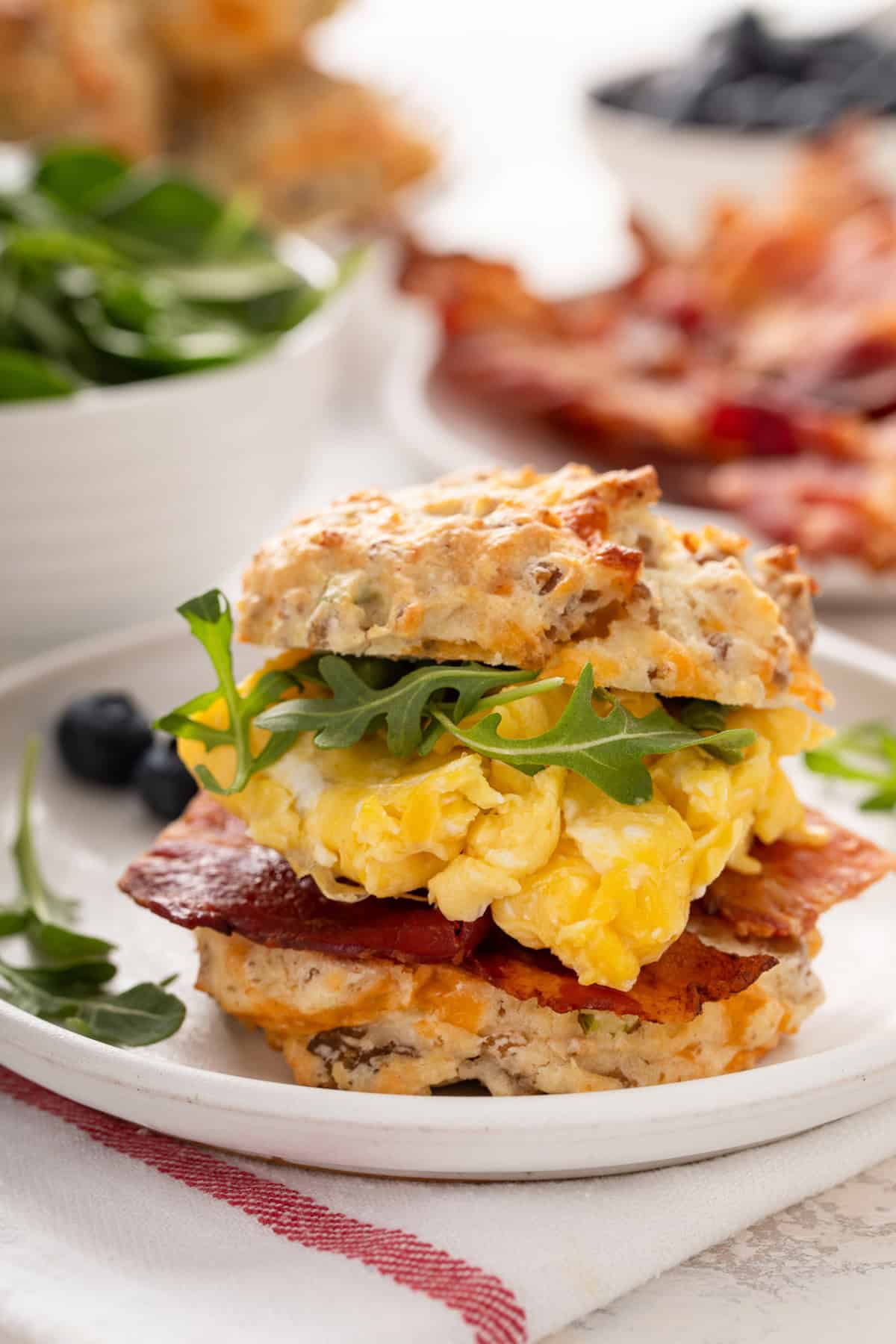 Breakfast sandwich made with a cheesy sausage biscuit as the bun.