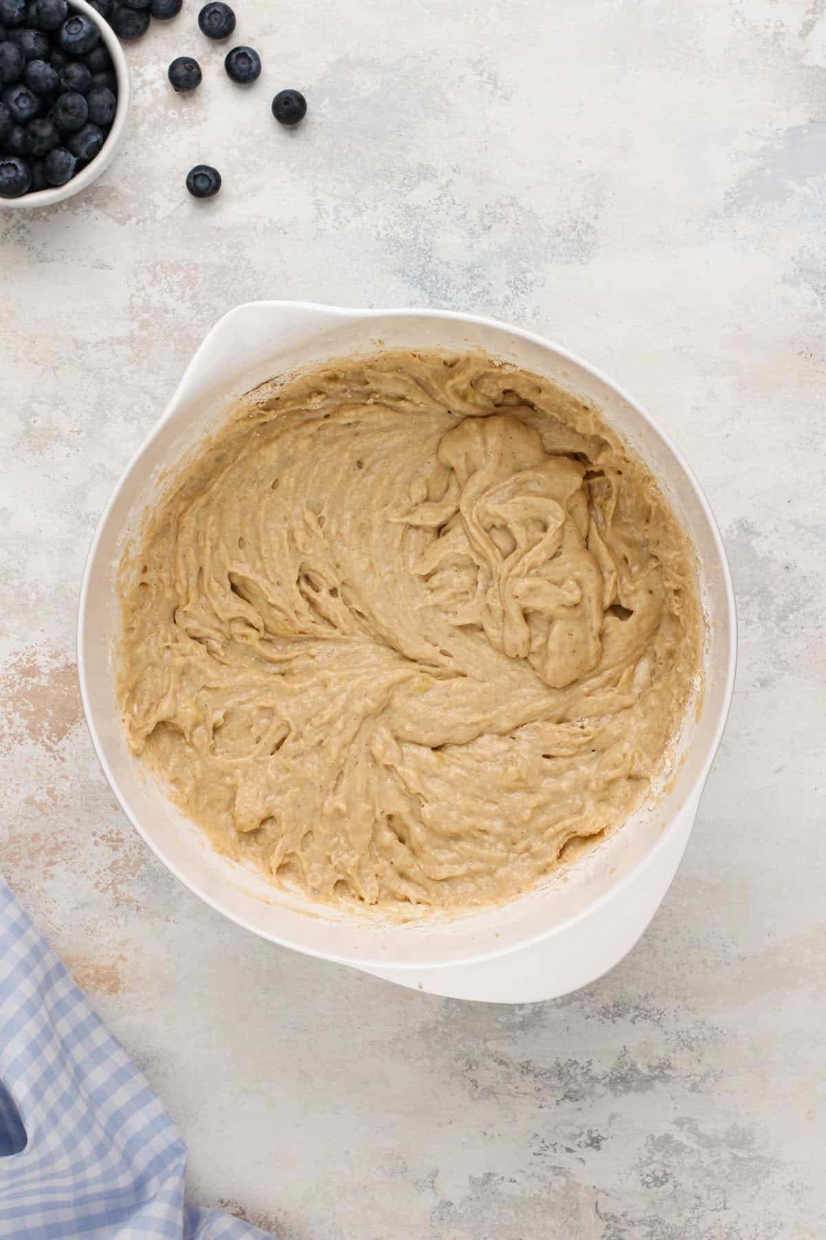 Batter base for blueberry banana bread in a bowl.