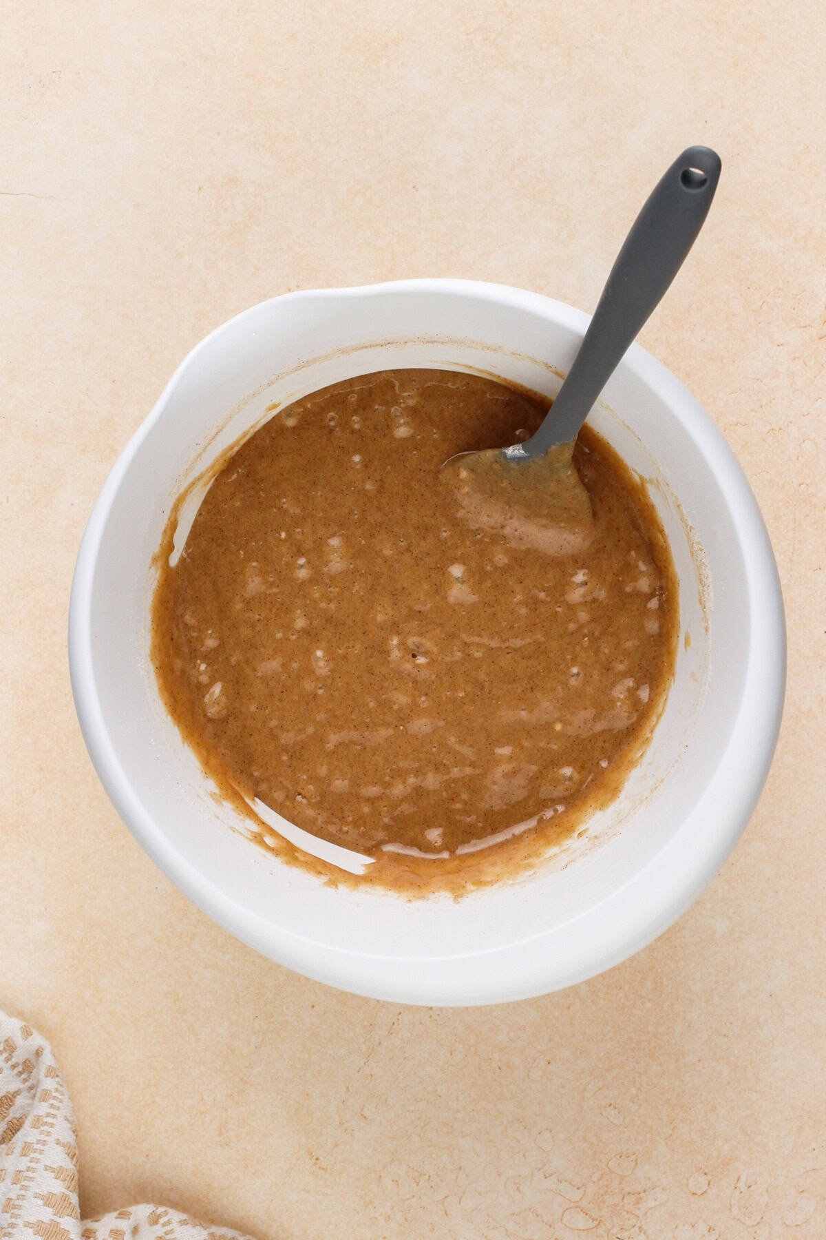 Batter base for carrot cake bars in a white bowl.