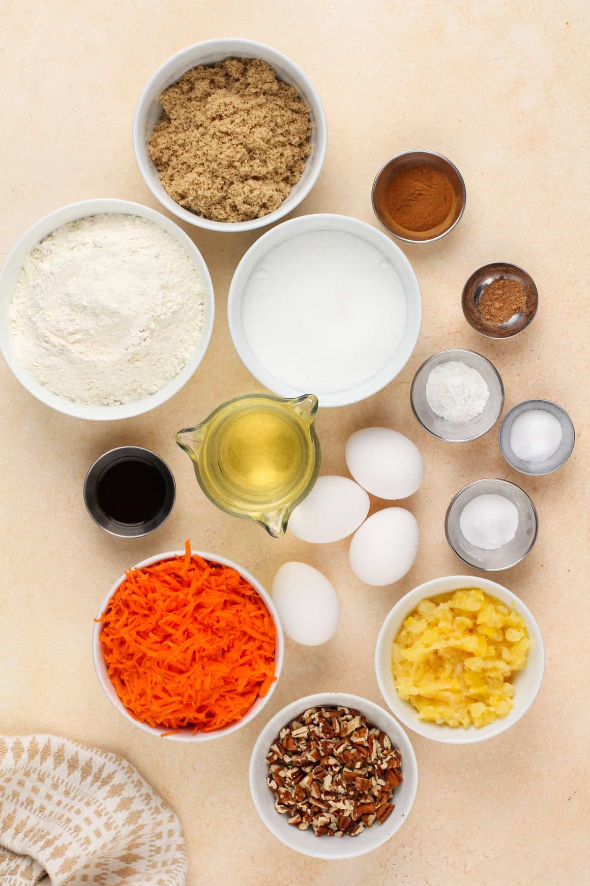 Carrot cake bar ingredients arranged on a countertop.