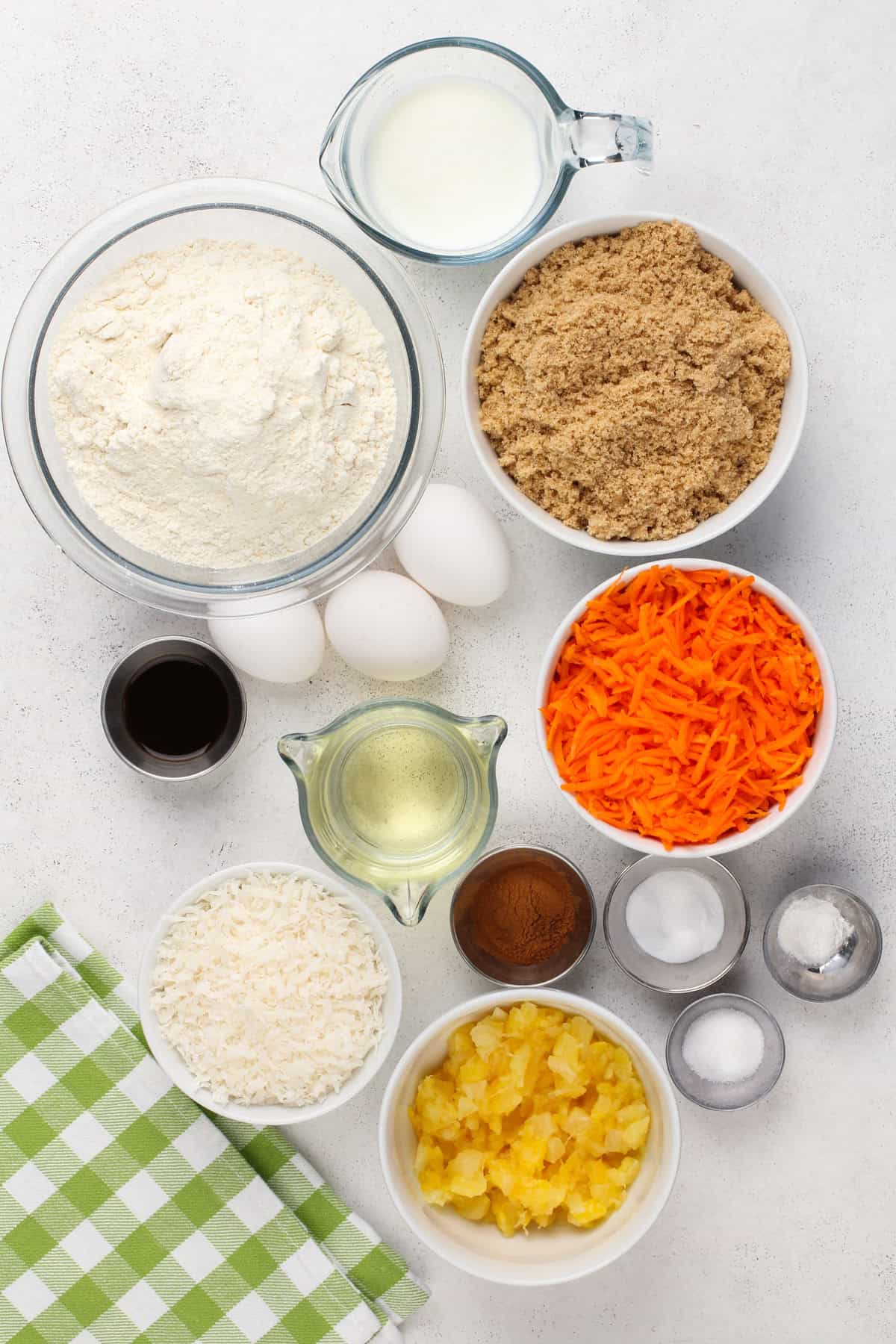 Carrot cake bread ingredients arranged on a countertop.