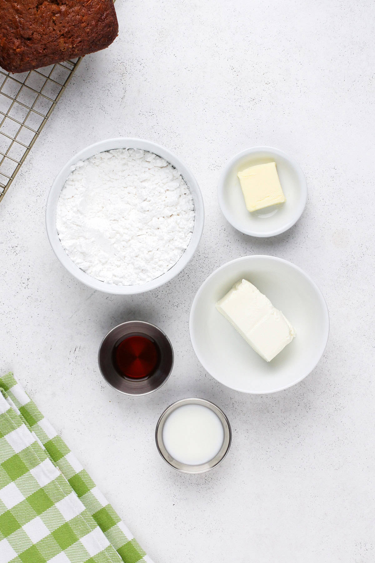 Cream cheese glaze ingredients arranged on a countertop.