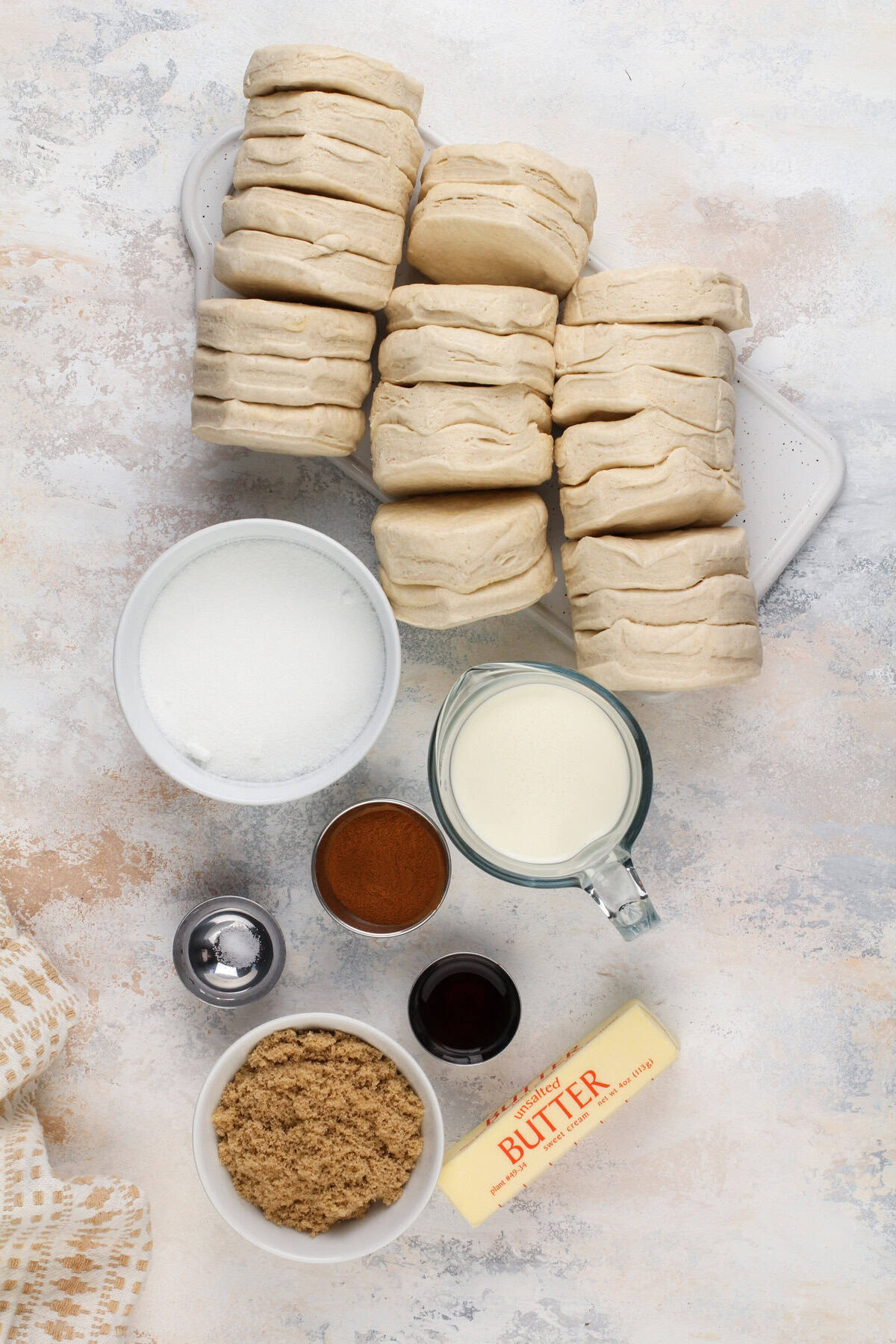 Ingredients for easy monkey bread arranged on a countertop.