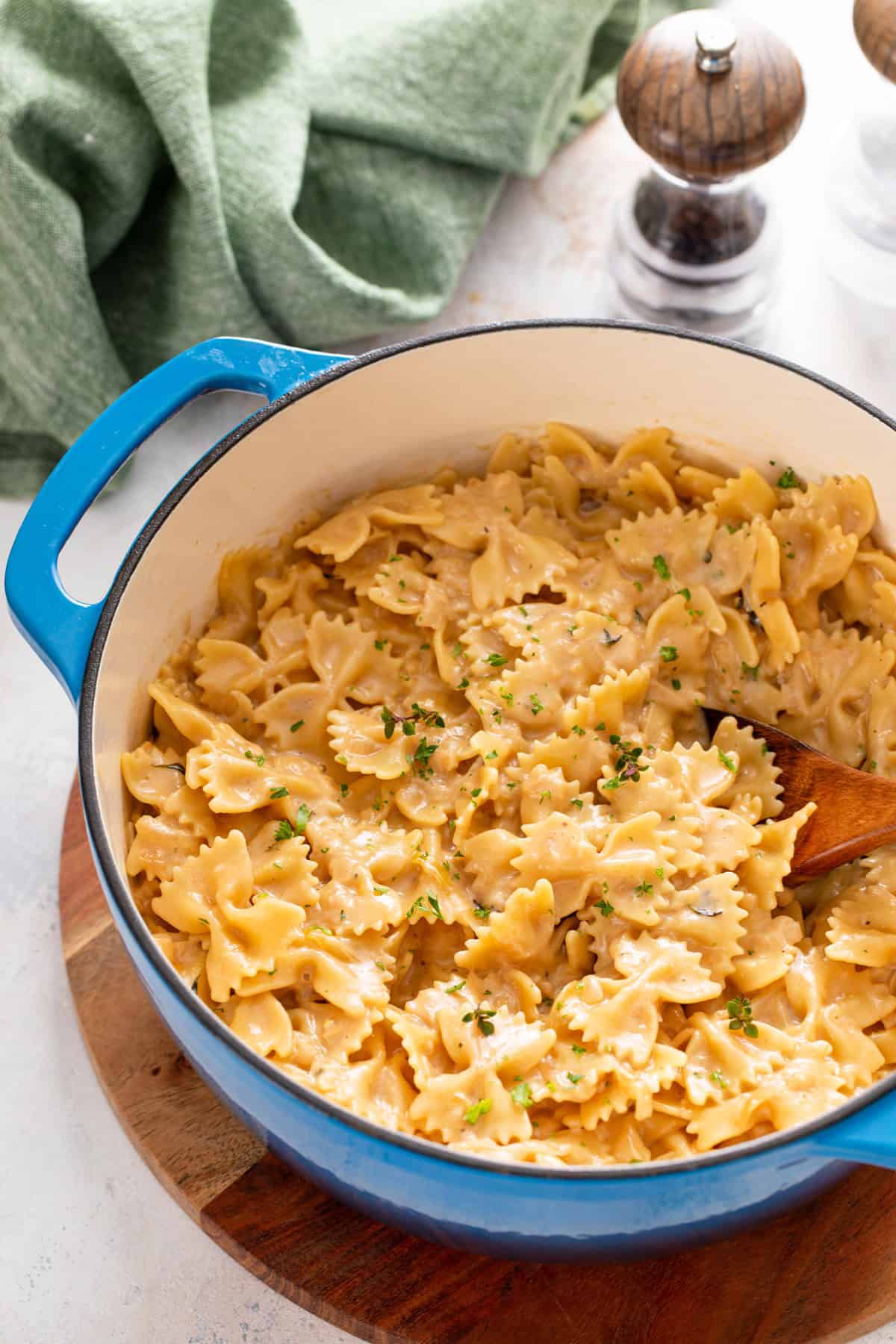 Finished french onion pasta in a blue dutch oven.