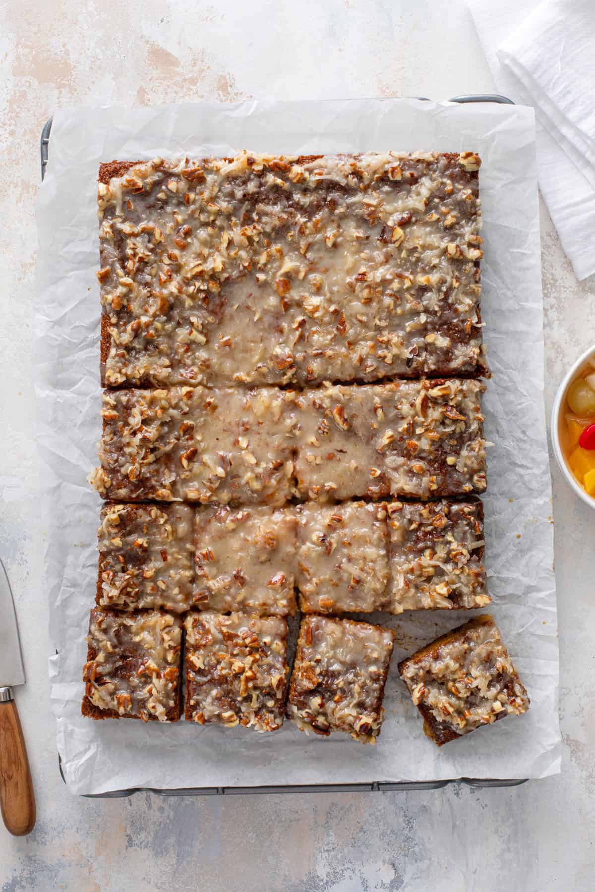Overhead view of sliced fruit cocktail cake.