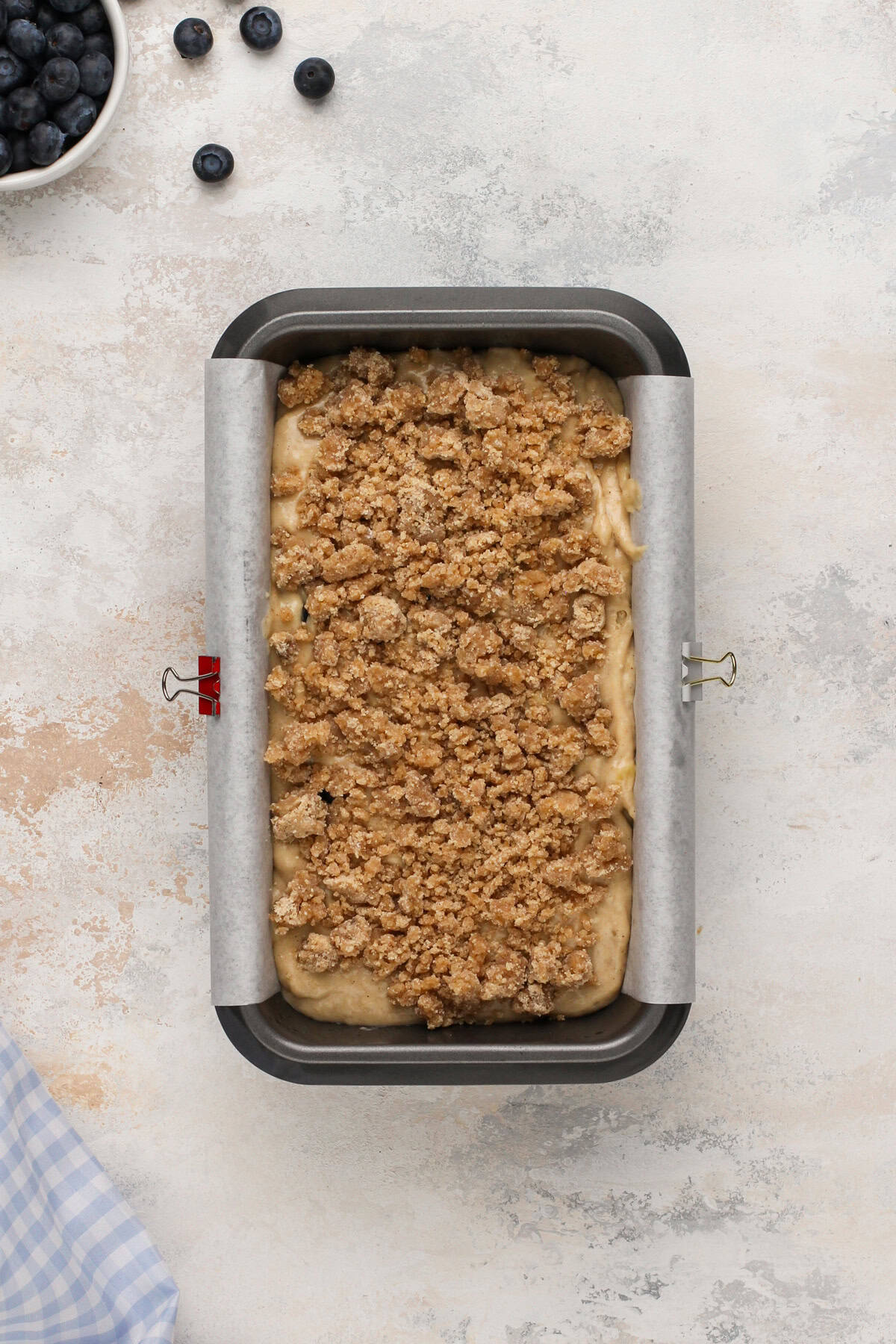 Assembled blueberry banana bread in a loaf pan.