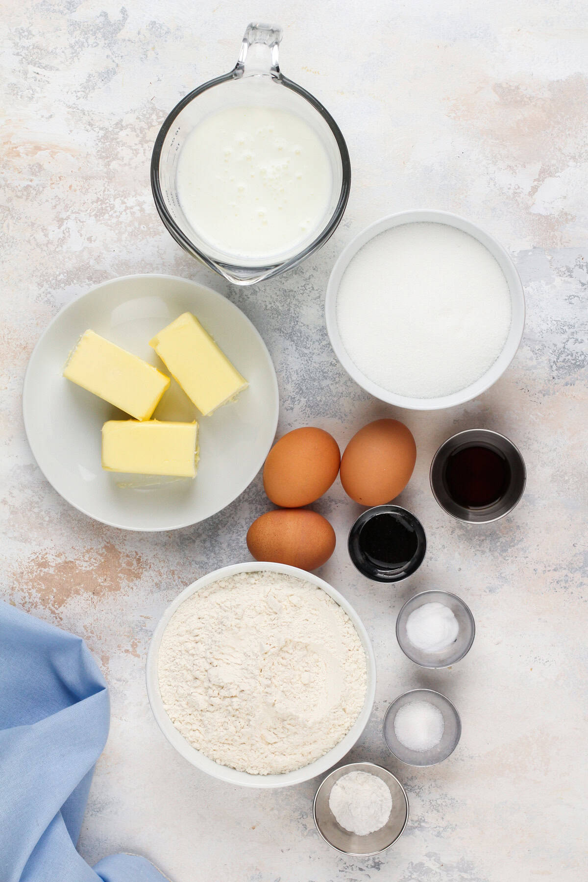 Vanilla cake ingredients arranged on a countertop.