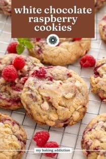 Close up image of white chocolate raspberry cookies on a wire rack. Text overlay includes recipe name.