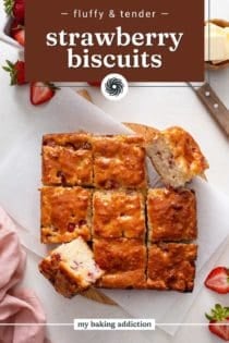 Overhead view of sliced strawberry biscuits. Text overlay includes recipe name.