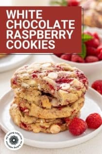 Stack of 4 white chocolate raspberry cookies with a bite taken from the top cookie. Text overlay includes recipe name.