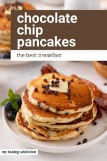 Stack of chocolate chip pancakes topped with a pat of butter on a white plate. Text overlay includes recipe name.