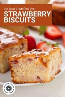 Strawberry biscuits and fresh strawberries on a white plate. Text overlay includes recipe name.
