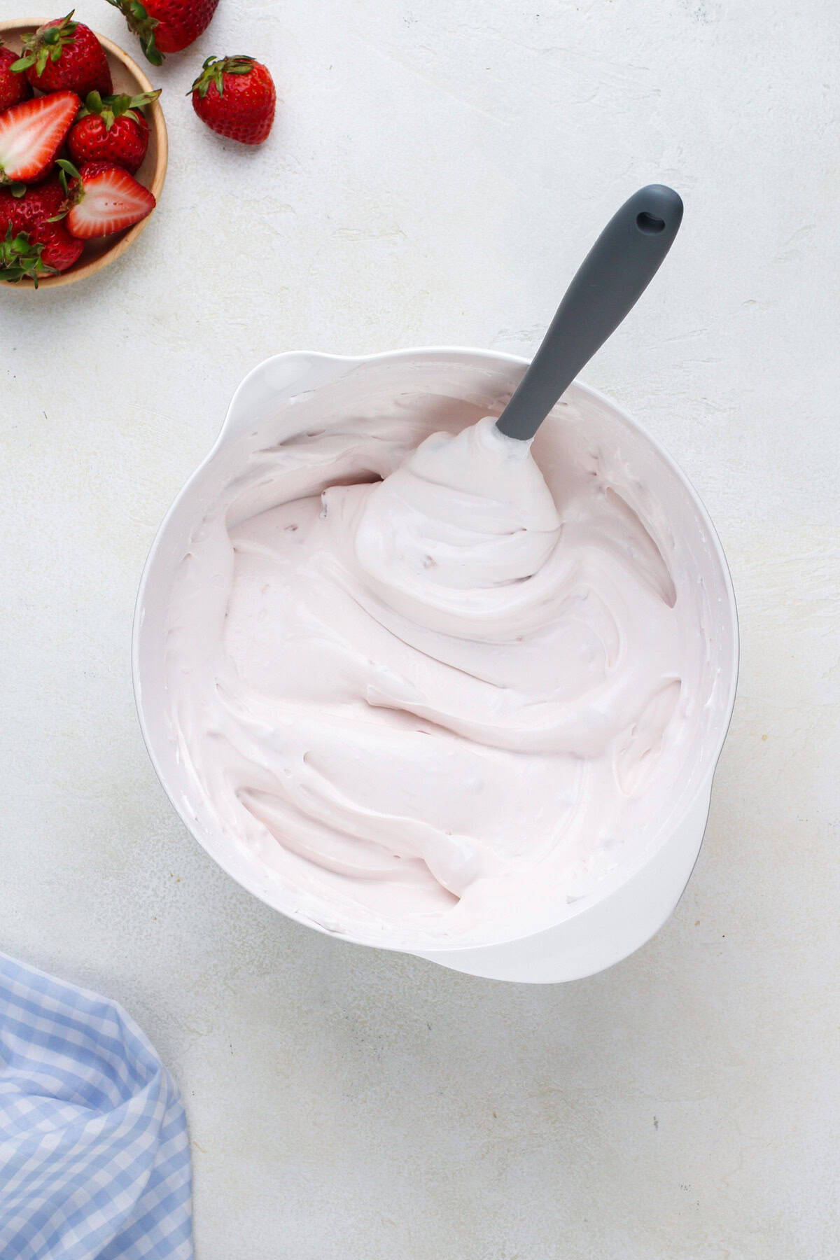 Cool whip mixed with strawberry yogurt.