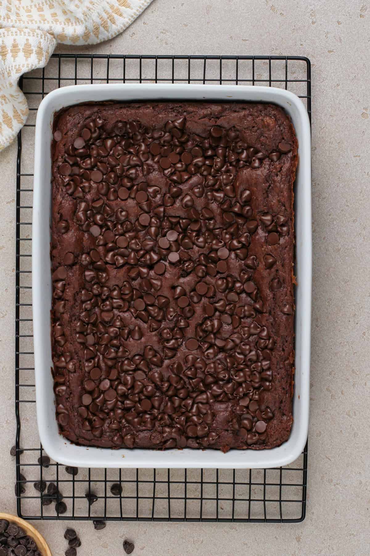 Baked chocolate dump cake cooling on a wire rack.