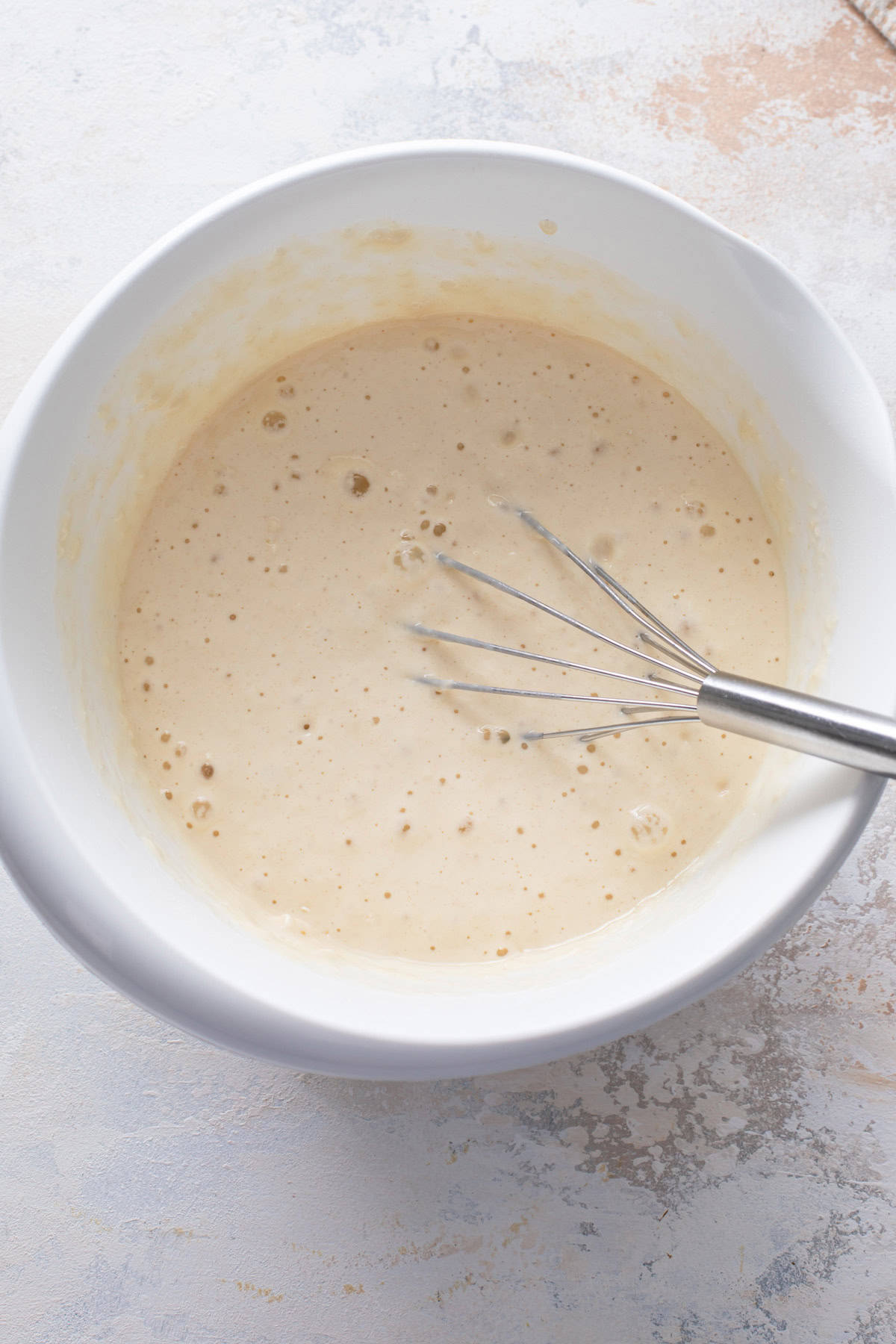 Pancake batter base resting in a white bowl.
