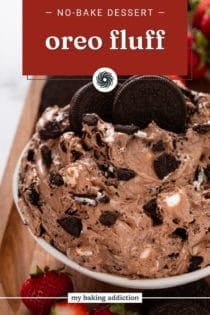 Close up of oreo fluff in a white serving bowl, garnished with whole oreos. Text overlay includes recipe name.