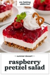 Close up of raspberry pretzel salad on a white baking dish. Text overlay includes recipe name.