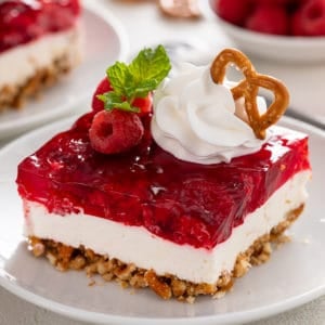 Close up image of slice of raspberry pretzel salad.