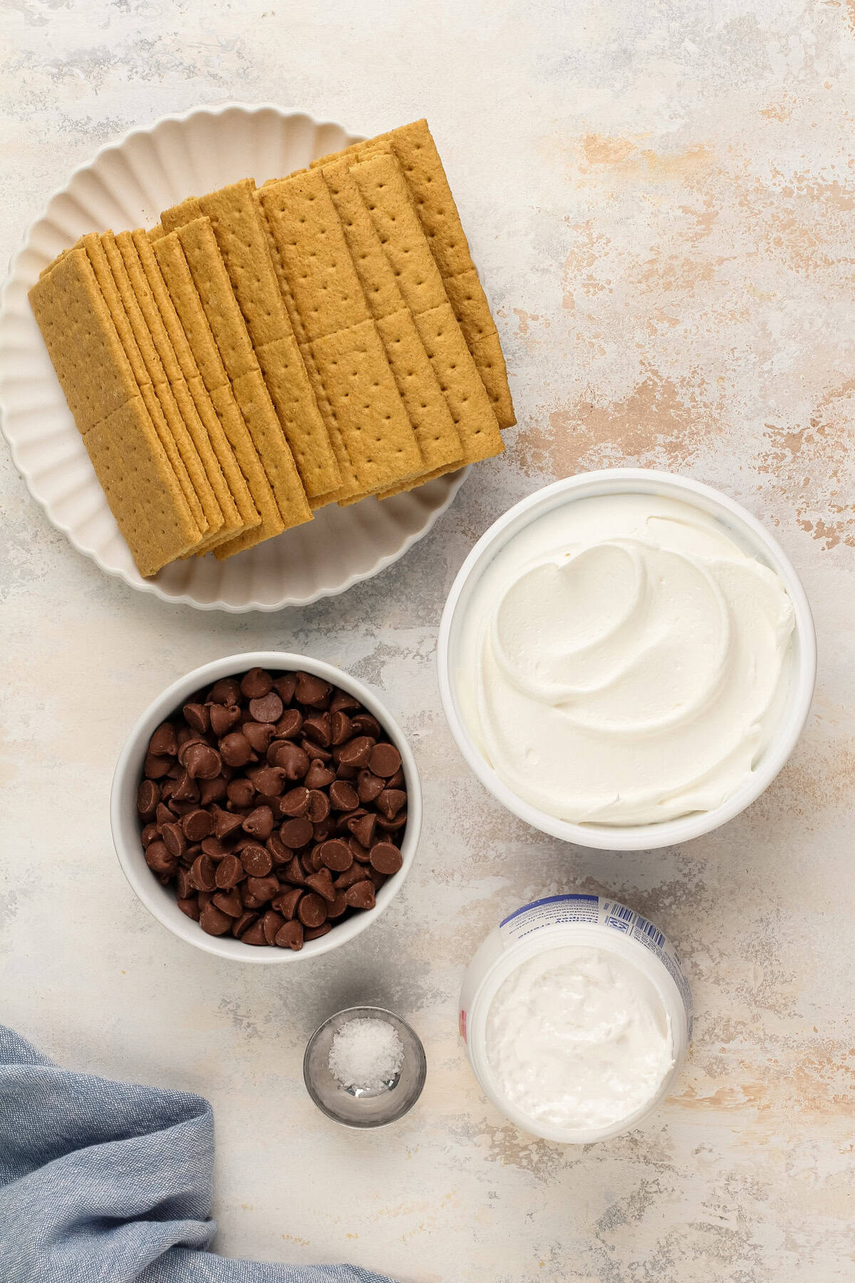 Frozen s'mores ingredients arranged on a countertop.