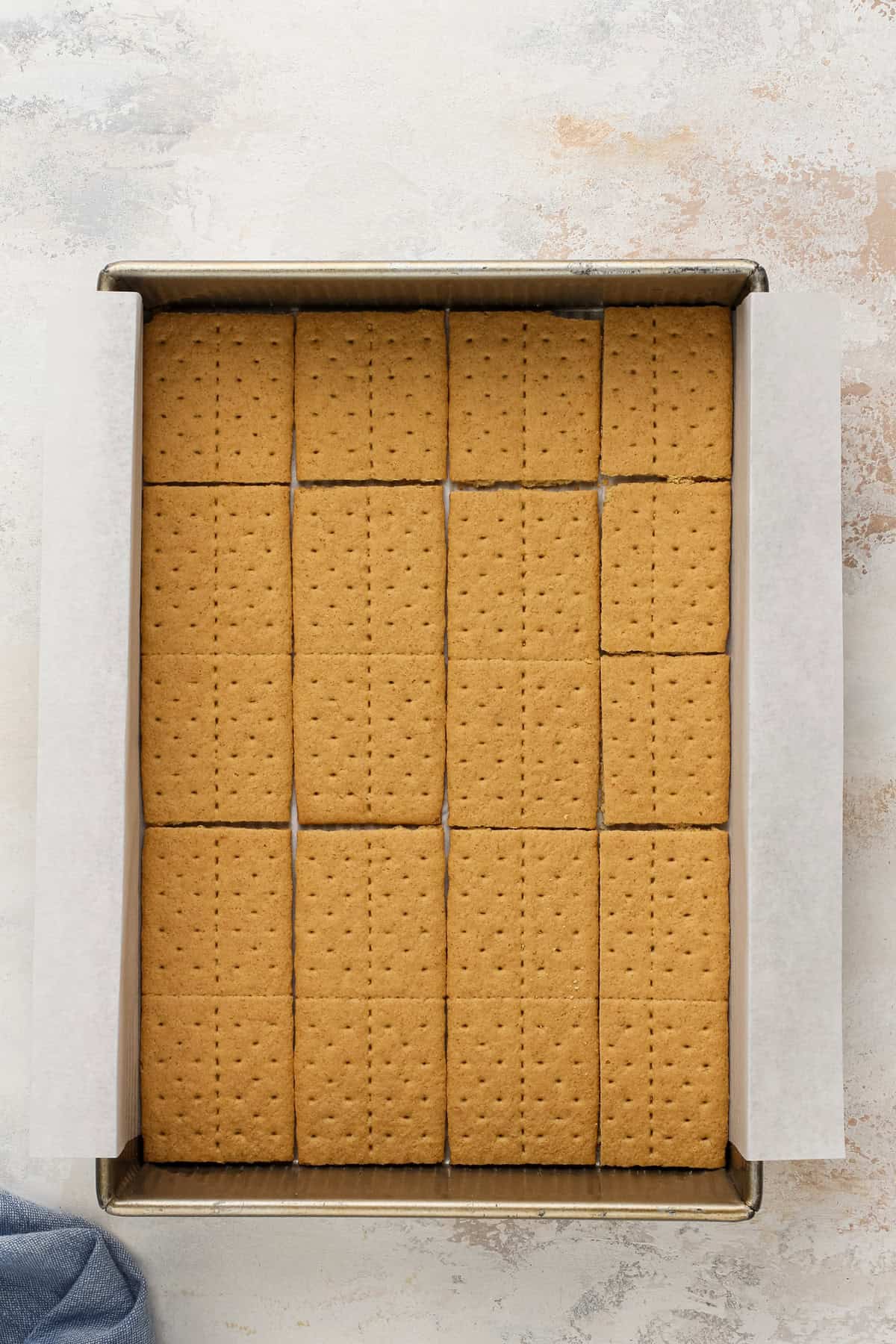Graham cracker sheets arranged in a baking pan.