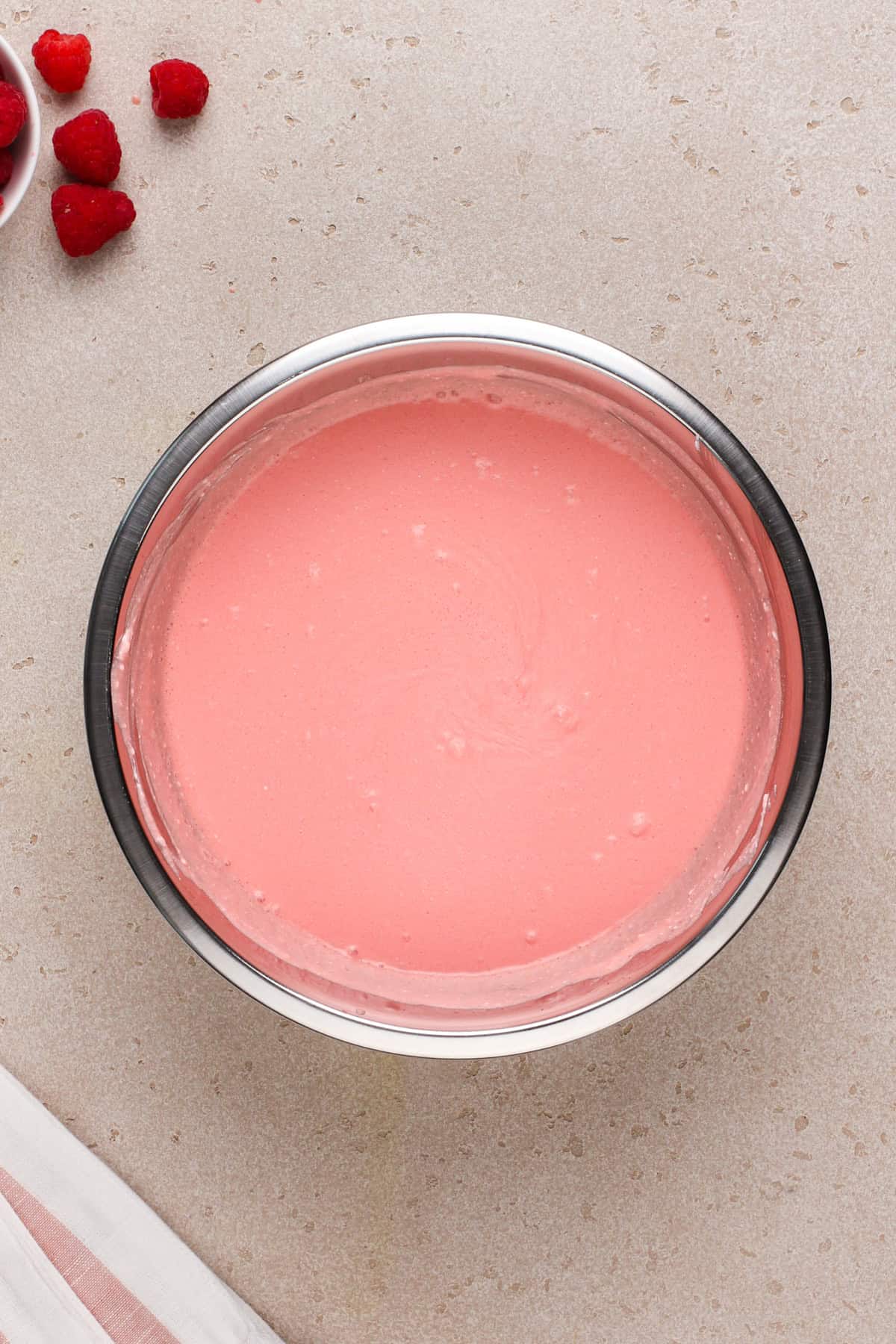 Jello pie filling mixed in a metal bowl.