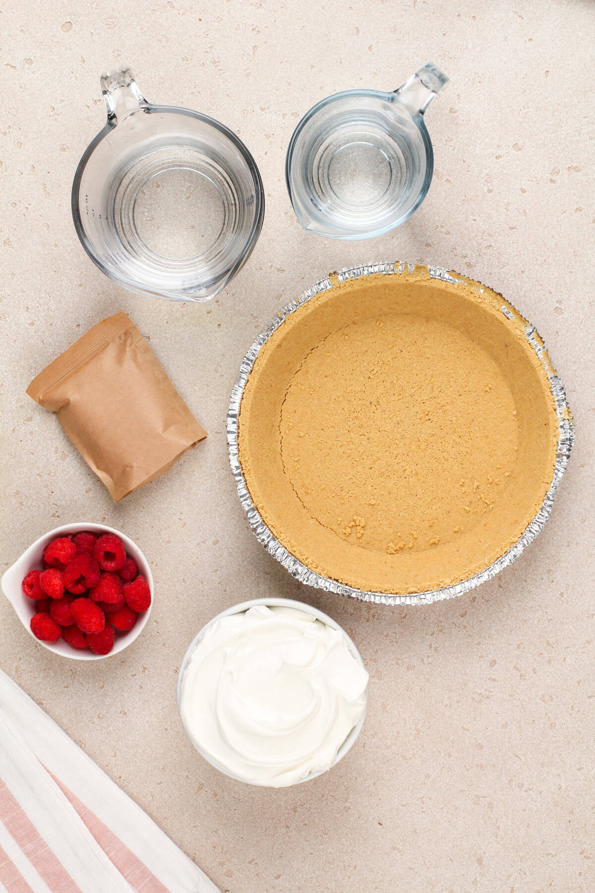 Jello pie ingredients arranged on a countertop.