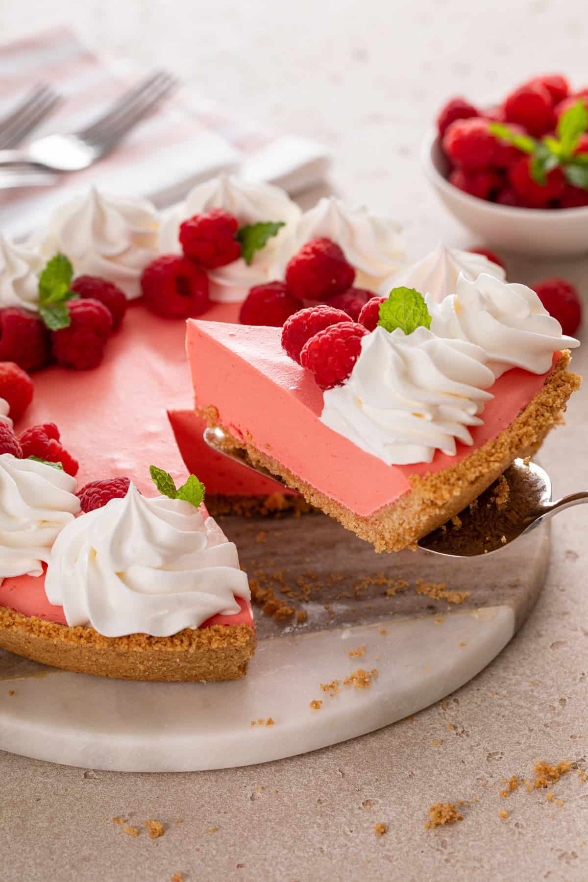 Pie server lifting up a slice of jello pie.