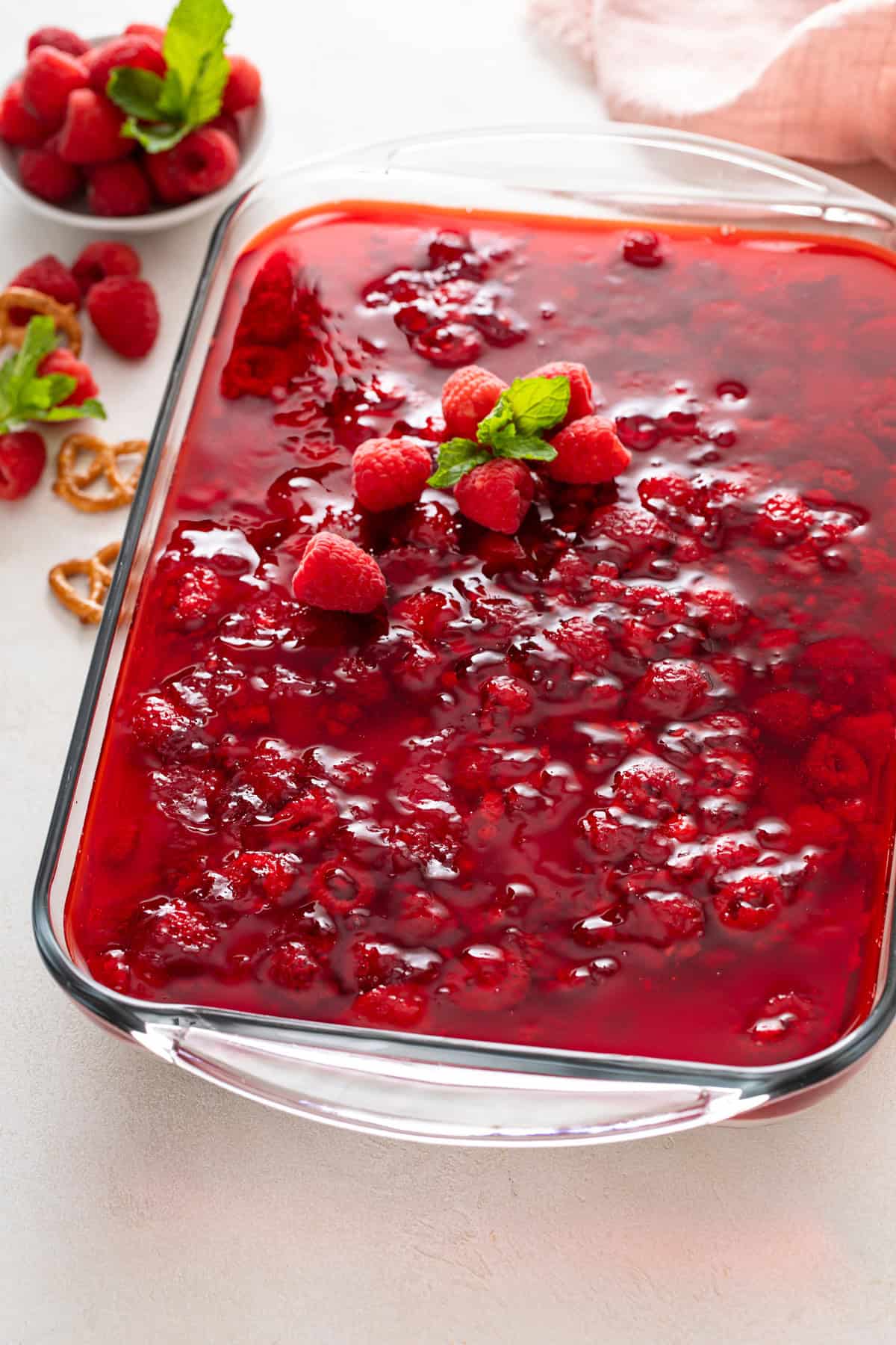 Set raspberry pretzel salad in a glass baking dish.