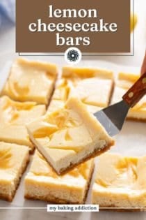 Cake server lifting up a sliced lemon cheesecake bar. Text overlay includes recipe name.