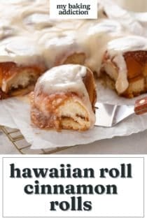 Cake server about to lift a hawaiian roll cinnamon roll. Text overlay includes recipe name.