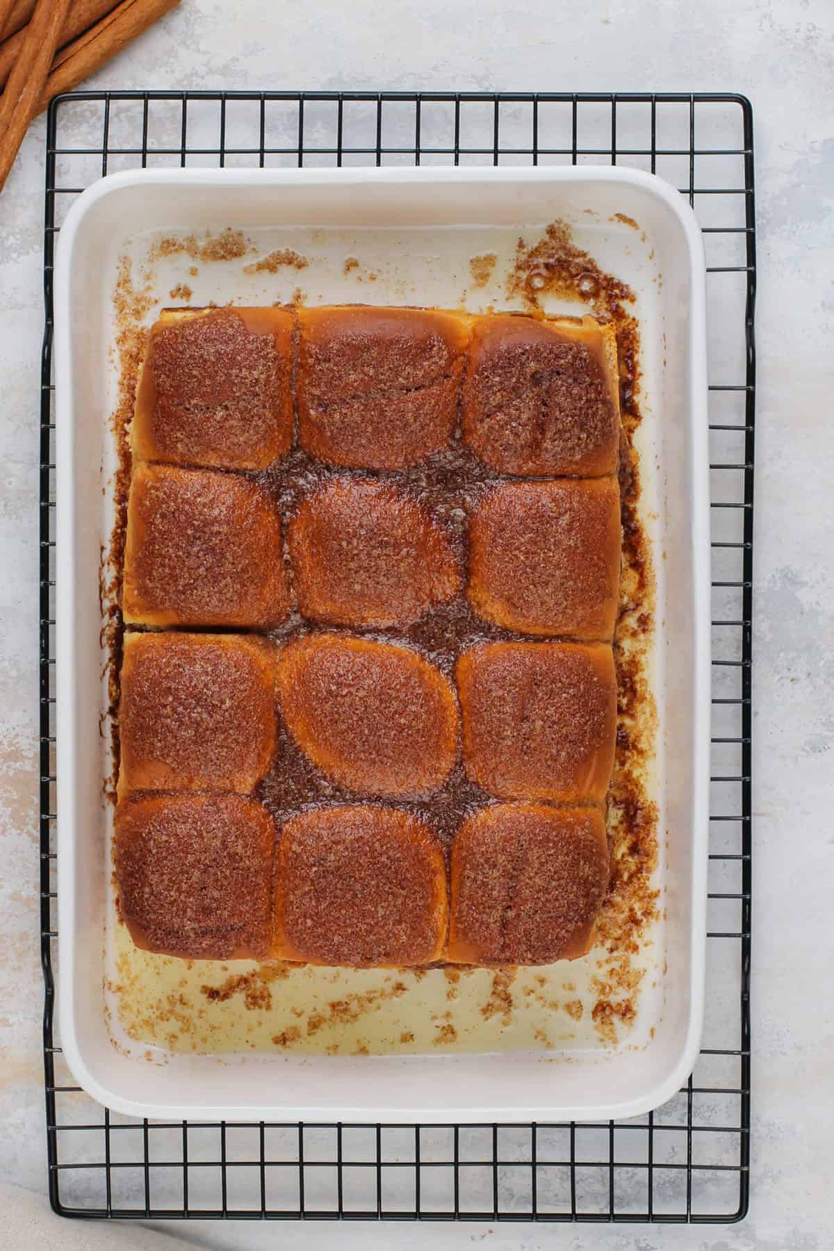 Baked hawaiian roll cinnamon rolls, cooling in the pan.