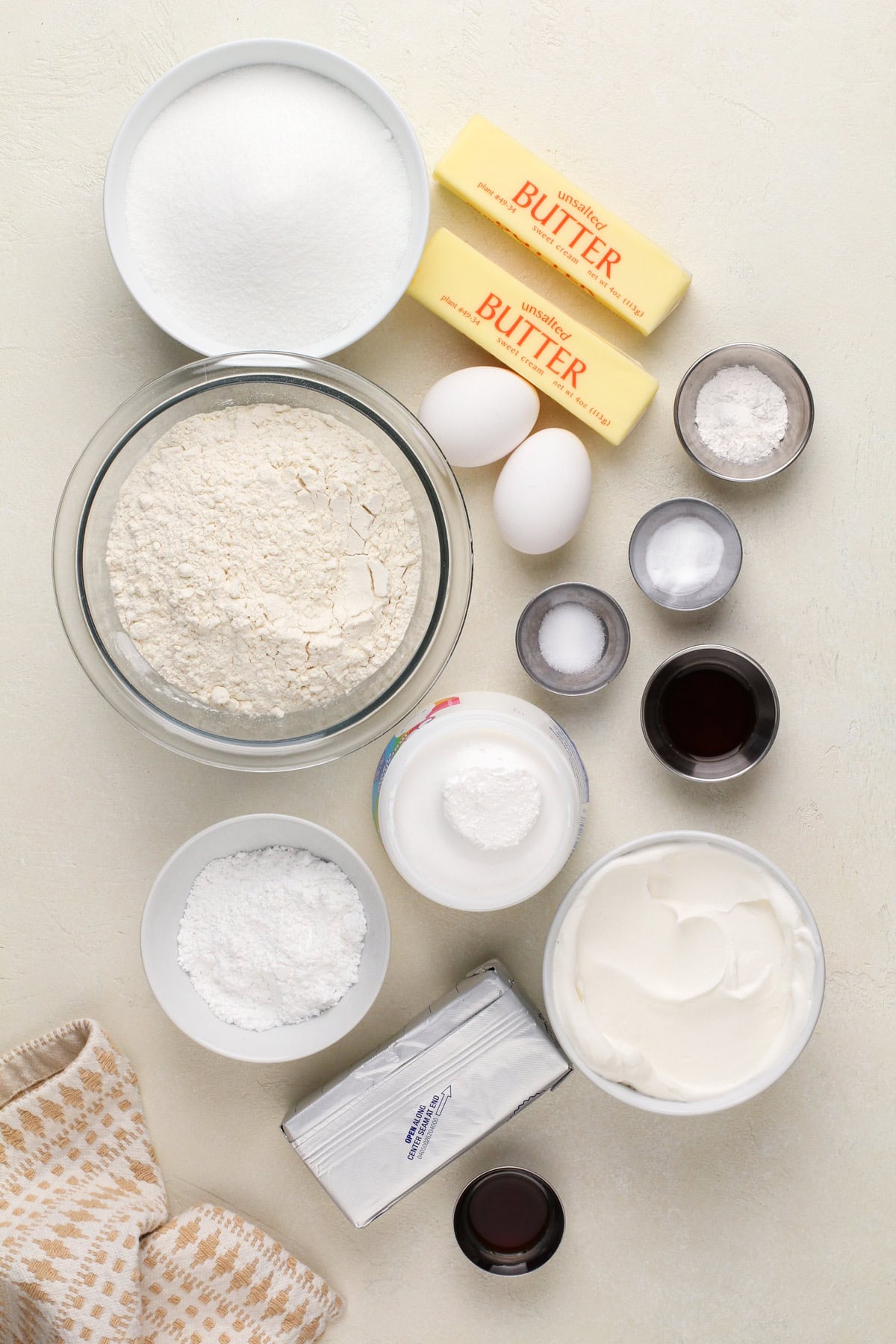 Fruit pizza ingredients arranged on a countertop.