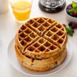 Plated stack of chocolate chip waffles.