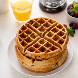 Plated stack of chocolate chip waffles.