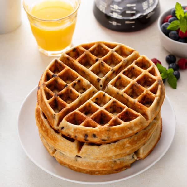 Plated stack of chocolate chip waffles.
