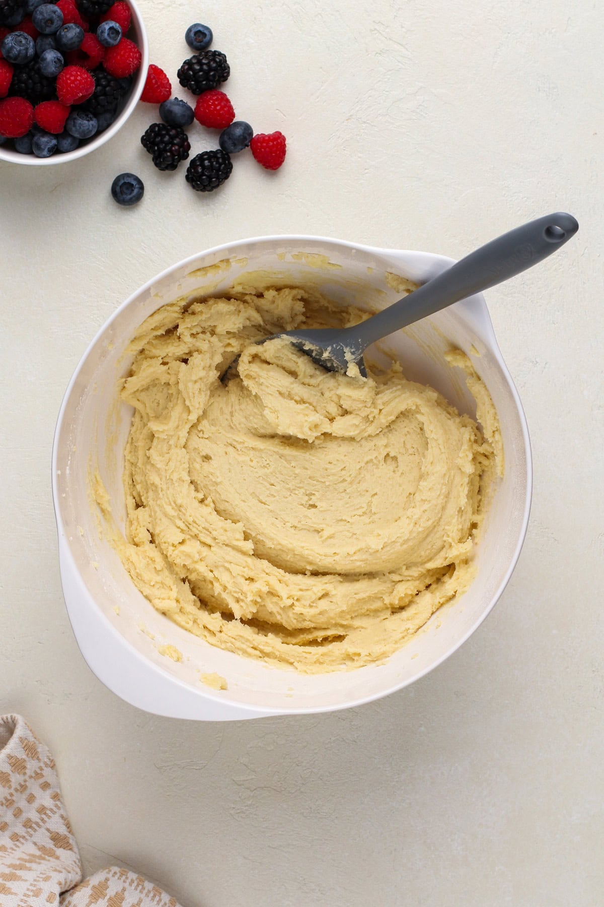 Sugar cookie dough in a white bowl.