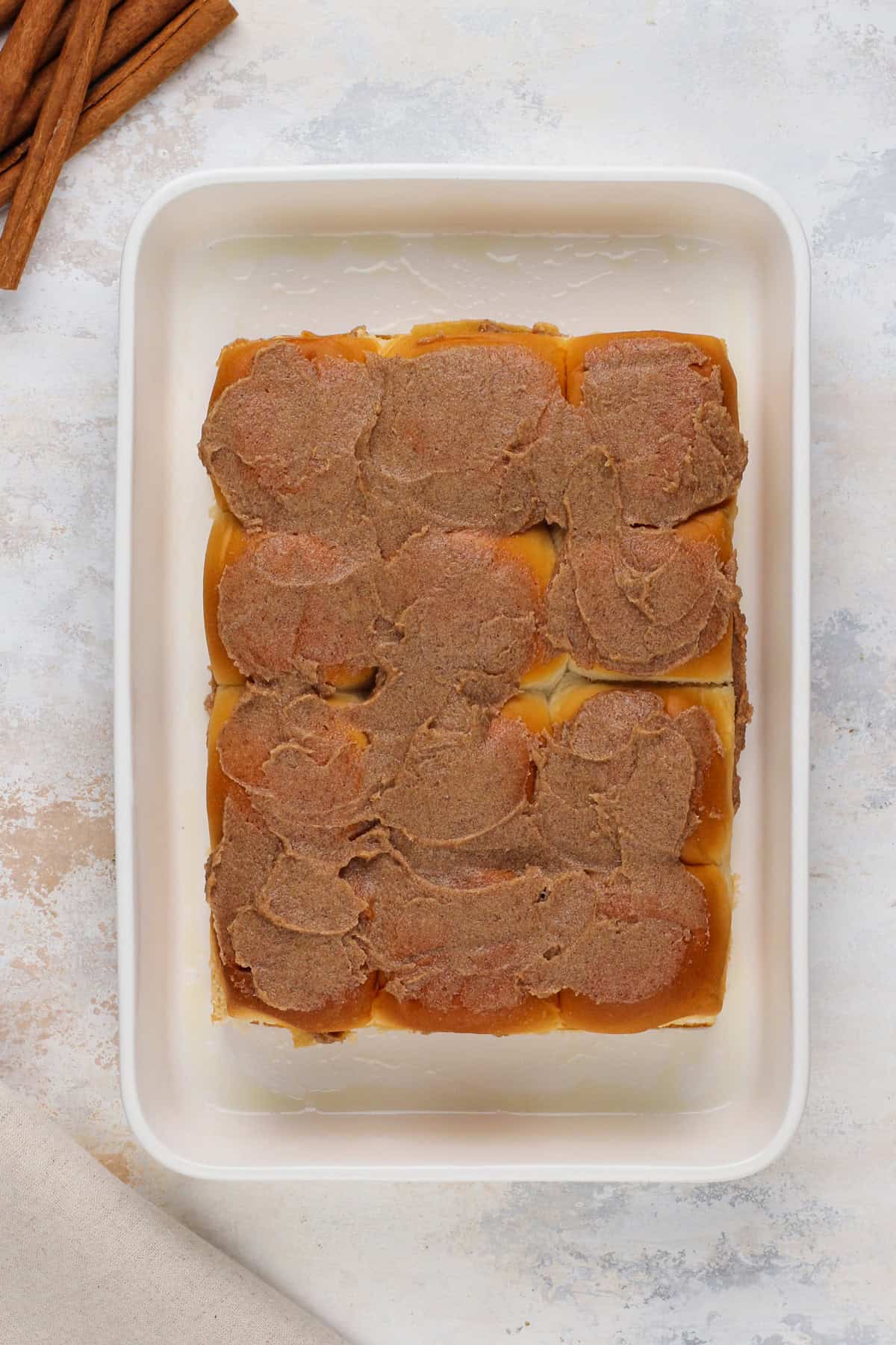 Unbaked hawaiian roll cinnamon rolls ready to go in the oven.
