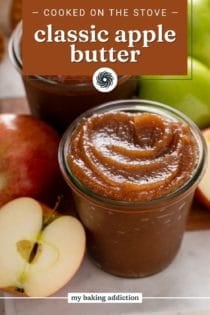 Close up of apple butter in a glass jar. Text overlay includes recipe name.
