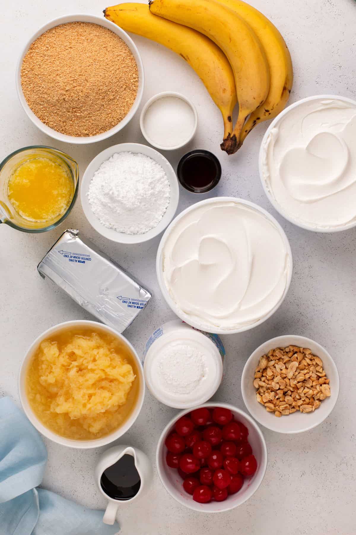 Overhead view of banana split cake ingredients arranged on a countertop.