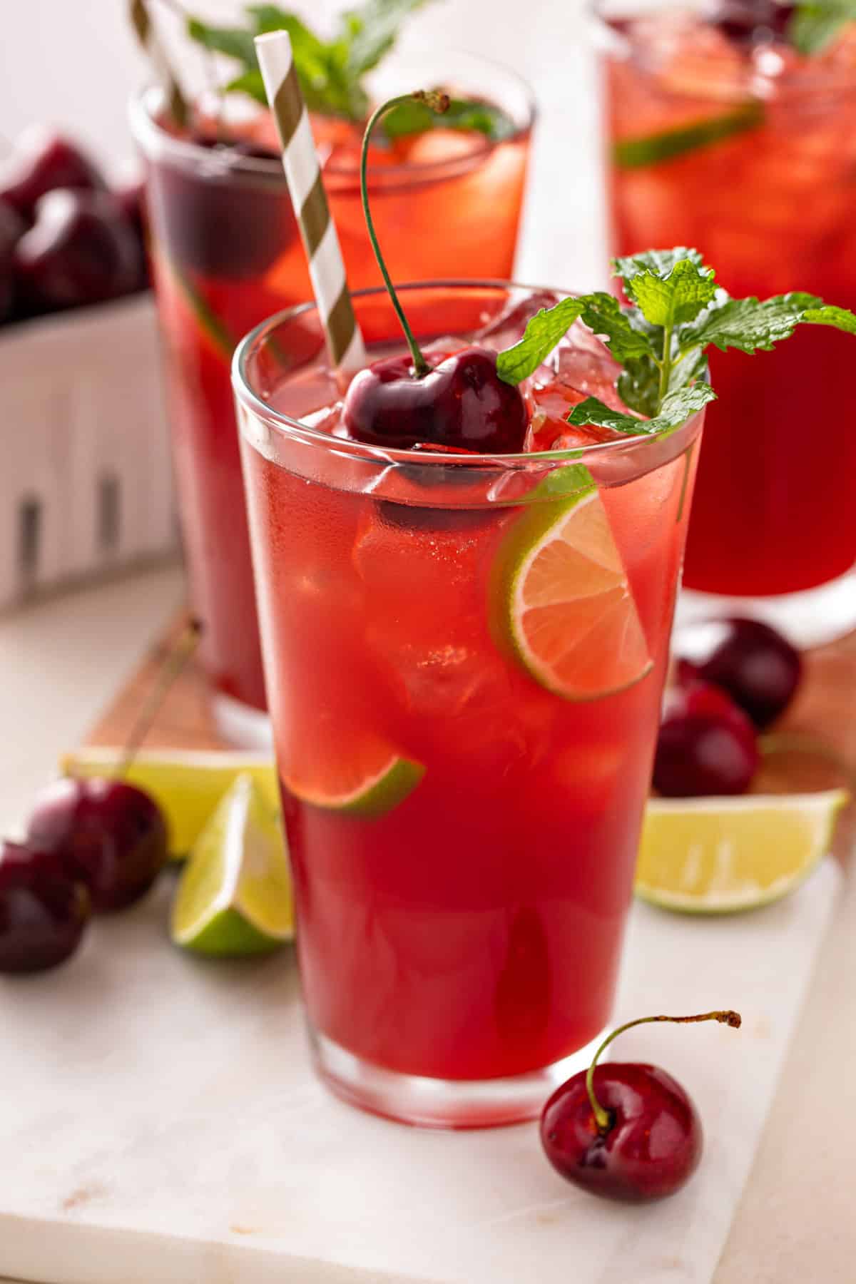 Close up of a glass of cherry limeade.