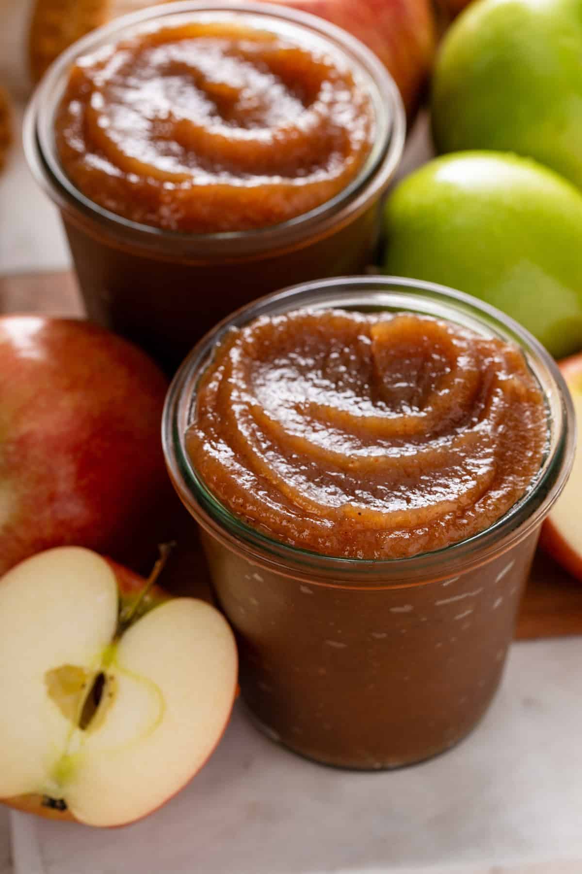 Close up of apple butter in a glass jar.