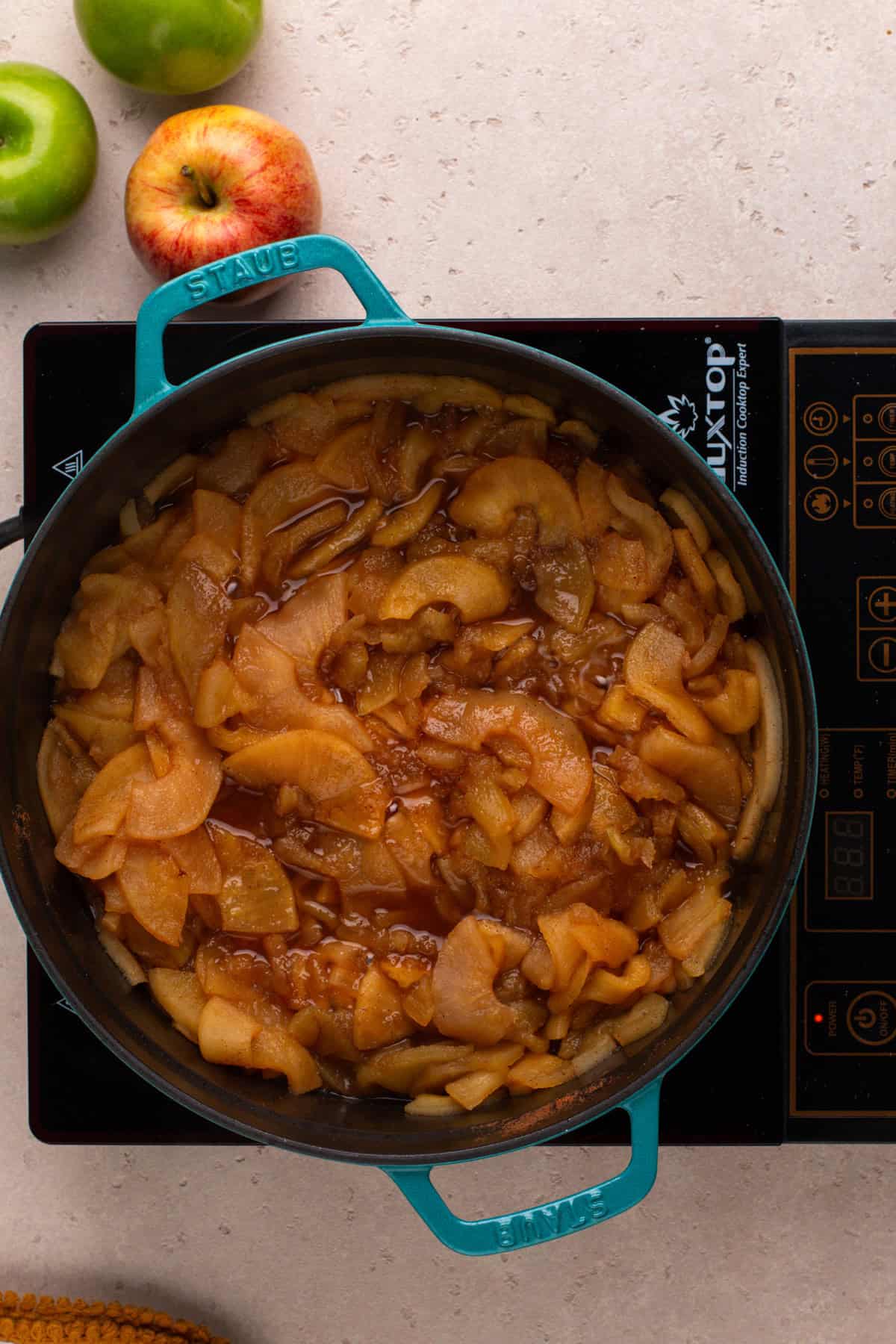 Cooked down apples in a dutch oven.