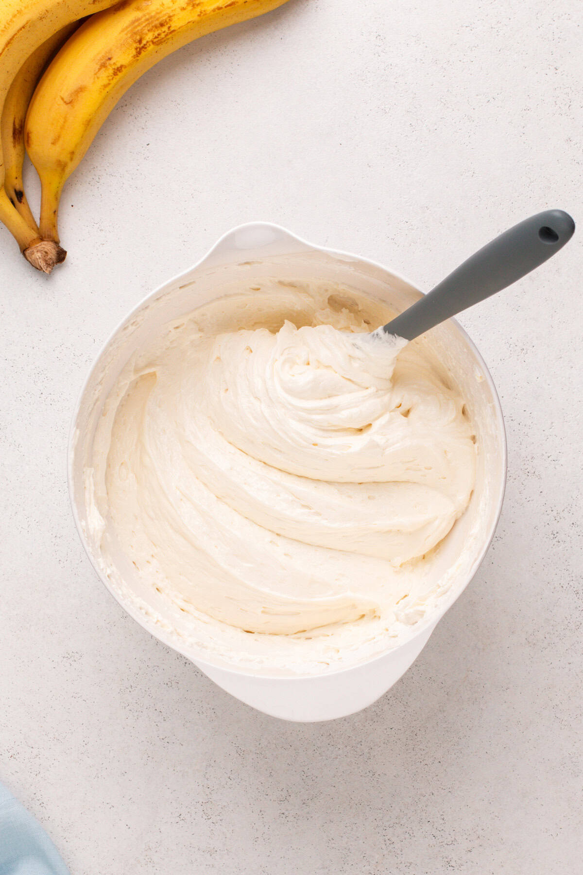 Cream cheese filling mixed in a white bowl.