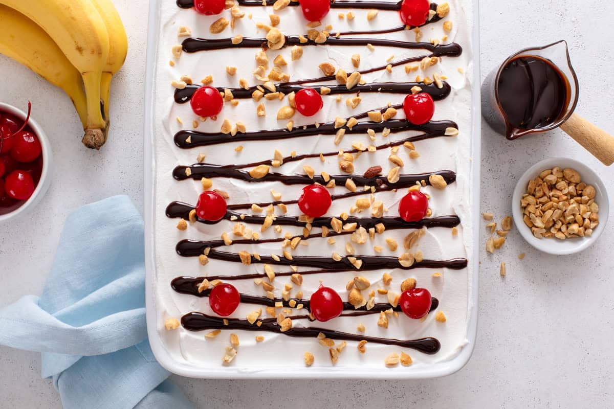 Overhead view of banana split cake in a baking dish.
