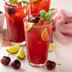 Glass filled with cherry limeade.