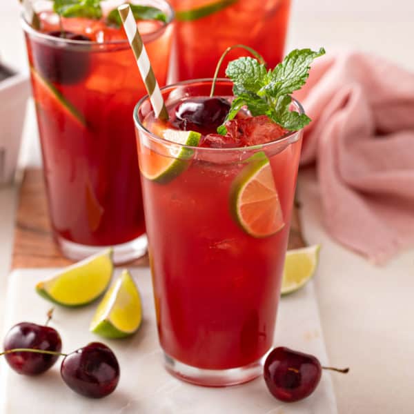 Glass filled with cherry limeade.
