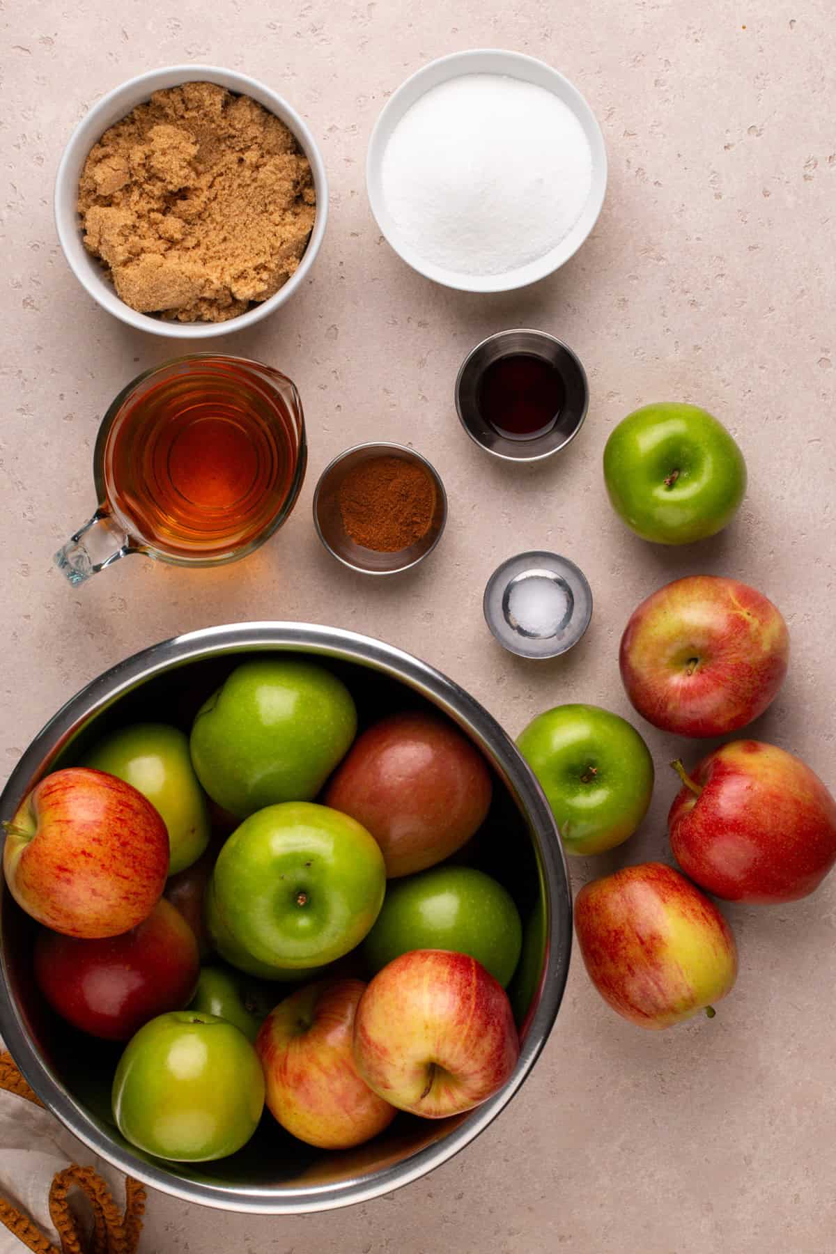 Stovetop apple butter ingredients arranged on a countertop.