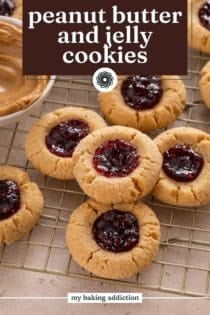 Peanut butter and jelly cookies arranged on a cooling rack. Text overlay includes recipe name.