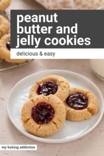 Close up of three peanut butter and jelly cookies on a white plate. Text overlay includes recipe name.