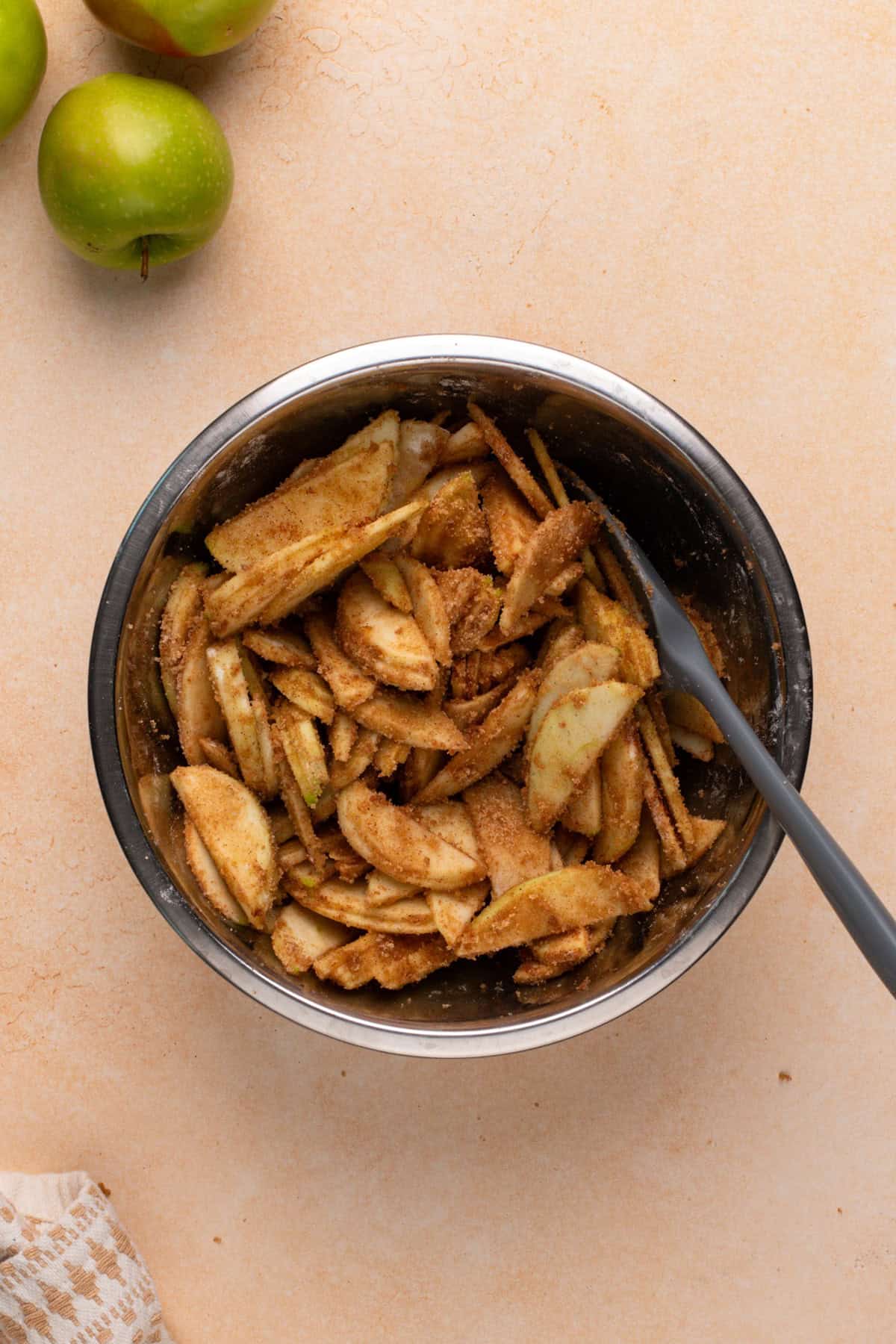 Filling for apple strudel mixed in a bowl.